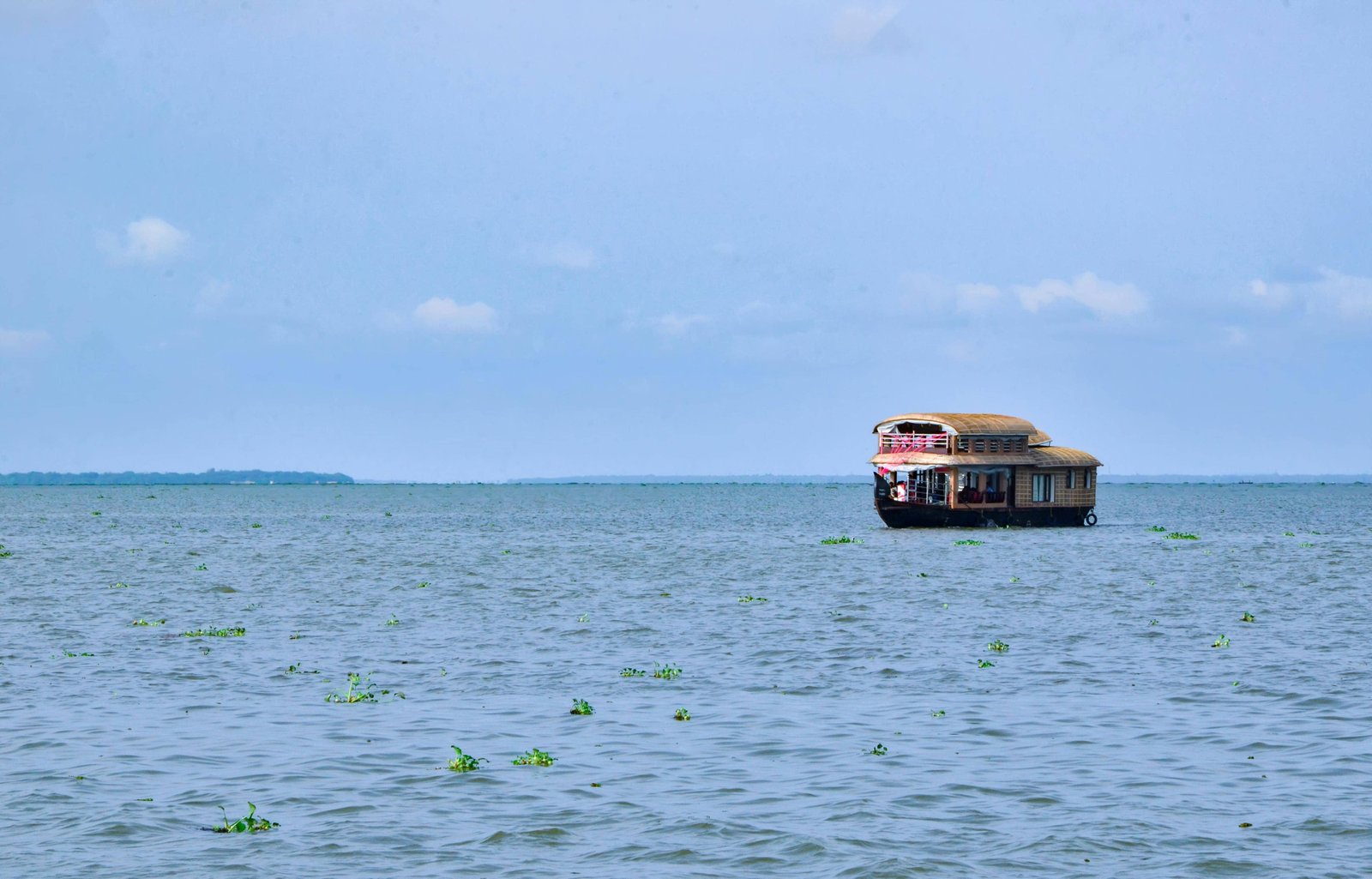 Backwaters tourism in India - Kerala houseboat kettuvallam sustainable tourism seven days Kerala tour package Alappuzha